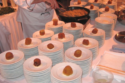 A photo of food and plates at an event