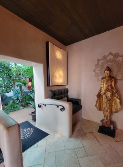 A Buddha statue inside a spa waiting area